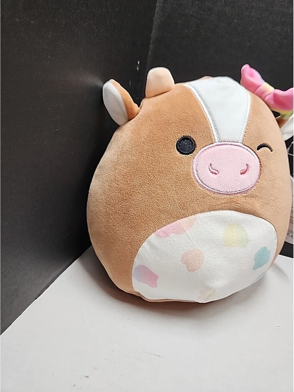 Squishmallows Griella the Winking Cow with Multi Color Bow Spots 7 Inch NEW NWT